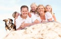 Happy Family and Dog Portrait at the Beach Royalty Free Stock Photo