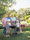 Happy family doing barbecue in the park Royalty Free Stock Photo