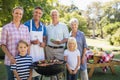 Happy family doing barbecue in the park Royalty Free Stock Photo