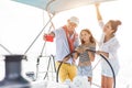 Happy family doing luxury sailboat trip - Father, mother and daughter doing selfie photo while having fun traveling in caribbean Royalty Free Stock Photo