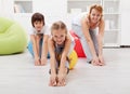 Happy family doing stretching exercises at home Royalty Free Stock Photo