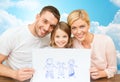 Happy family with drawing or picture Royalty Free Stock Photo