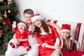 Happy family dressed in Santa costumes Royalty Free Stock Photo
