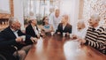 Happy Family Drink Drinks.Doctor at Head of Table