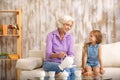 Happy family drinking hot beverage together Royalty Free Stock Photo