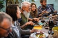 Happy family eating at barbecue home party dinner - Different age of people having fun at bbq meal in villa backyard - Summer Royalty Free Stock Photo