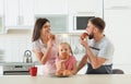 Happy family eating freshly oven baked buns