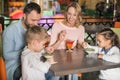 happy family eating sweet desserts together Royalty Free Stock Photo