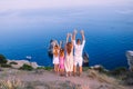 Happy family of four walking in the mountains on the sunset Royalty Free Stock Photo