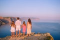 Happy family of four walking in the mountains on the sunset Royalty Free Stock Photo