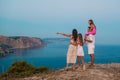 Happy family of four walking in the mountains on the sunset Royalty Free Stock Photo