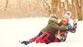 Happy family enjoing winter vacation. Young mother having fun with her son outdoors. Family playing with snow in winter park Royalty Free Stock Photo