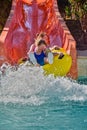 Happy family enjoy water slides in Aqua Park Royalty Free Stock Photo