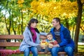Happy family enjoying autumn picnic. Father mother and son sit o Royalty Free Stock Photo