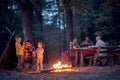 A happy family enjoying beautiful autumn dusk in the forest Royalty Free Stock Photo