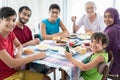 Happy family enjoying eating food in dining room together