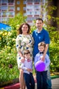 Happy family enjoying life together at meadow outdoor Royalty Free Stock Photo