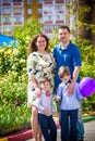 Happy family enjoying life together at meadow outdoor Royalty Free Stock Photo