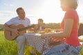 Happy family enjoying lunch outdoors Royalty Free Stock Photo