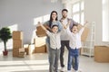 Happy family enjoying relocating to new apartment concept