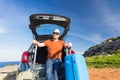 Happy man enjoying road trip and summer vacation. Travel, holidays and people concept Royalty Free Stock Photo