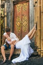 Happy family enjoying romantic honeymoon holiday on black sand beach Royalty Free Stock Photo