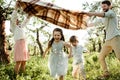 Happy family enjoying spring together at apple orchard