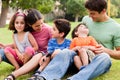 Happy family enjoying summer day in the park