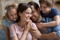 Happy family enjoying tender moment, parents and children hugging Royalty Free Stock Photo