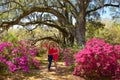 Happy family enjoying time together in blooming garden. Royalty Free Stock Photo