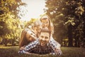 Happy family enjoying together in summer day. Little girls lying Royalty Free Stock Photo