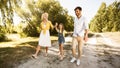 Happy Family Enjoying Walk Near River In Countryside, Panorama Royalty Free Stock Photo