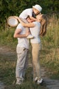 Happy family enjoying walk together at meadow in summer Royalty Free Stock Photo