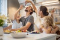 Happy family enjoying weekend breakfast together sitting at table in kitchen dessert waffles Royalty Free Stock Photo