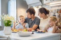 Happy family enjoying weekend breakfast together sitting at table in kitchen dessert waffles Royalty Free Stock Photo