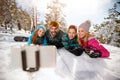 Family enjoying winter vacations in mountains and making selfie Royalty Free Stock Photo