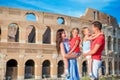 Happy family in Europe. Parents and kids in Rome over Coliseum background. Italian european vacation together Royalty Free Stock Photo