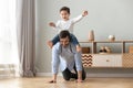 Happy family excited little boy playing with father at home Royalty Free Stock Photo