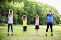 Happy family exercising  together at the park Royalty Free Stock Photo