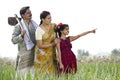 Happy Indian family in agricultural field