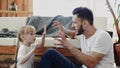 Happy family father and baby child daughter playing on floor at home Royalty Free Stock Photo