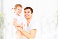 Happy family father and baby daughter playing in bed Royalty Free Stock Photo