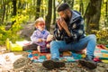 Parent teach baby. Happy family, father and baby son playing and laughing on autumn walk. Father playing with little son