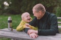 Happy Family: Father And Child Boy Son Playing And Laughing In Autumn Park, Sitting On Wooden Bench And Table. Father Royalty Free Stock Photo