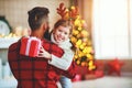 Happy family father and child daughter giving christmas gift Royalty Free Stock Photo