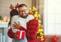 Happy family father and child daughter giving christmas gift Royalty Free Stock Photo