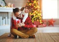 Happy family father and child daughter giving christmas gift Royalty Free Stock Photo