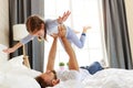 Happy family father and child daughter at home in bed Royalty Free Stock Photo