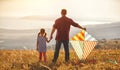 Happy family father and child daughter launch kite on meadow Royalty Free Stock Photo