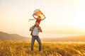 Happy family father and child daughter run with kite on meadow Royalty Free Stock Photo